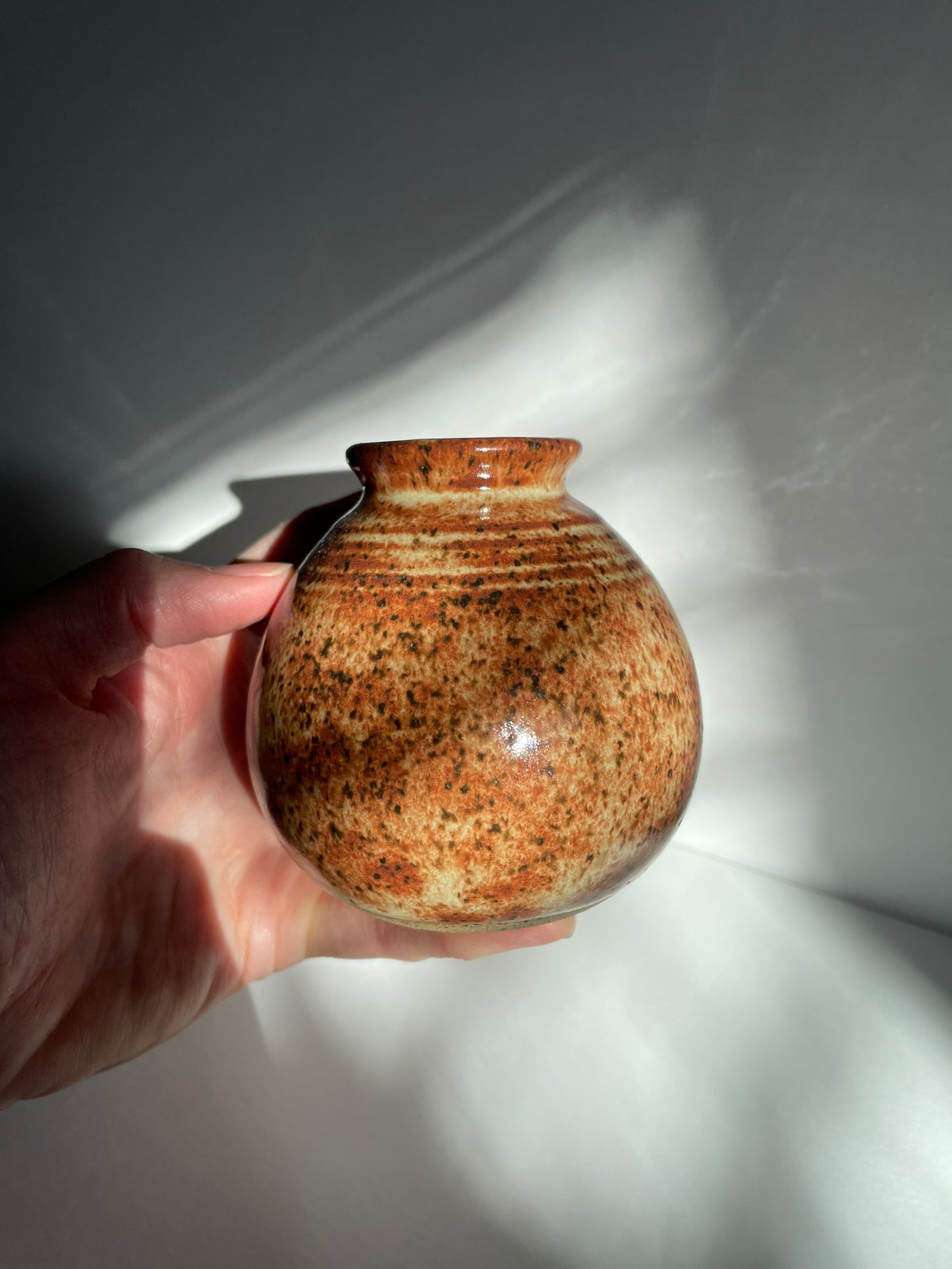 A. Short chai bottle vase with lines