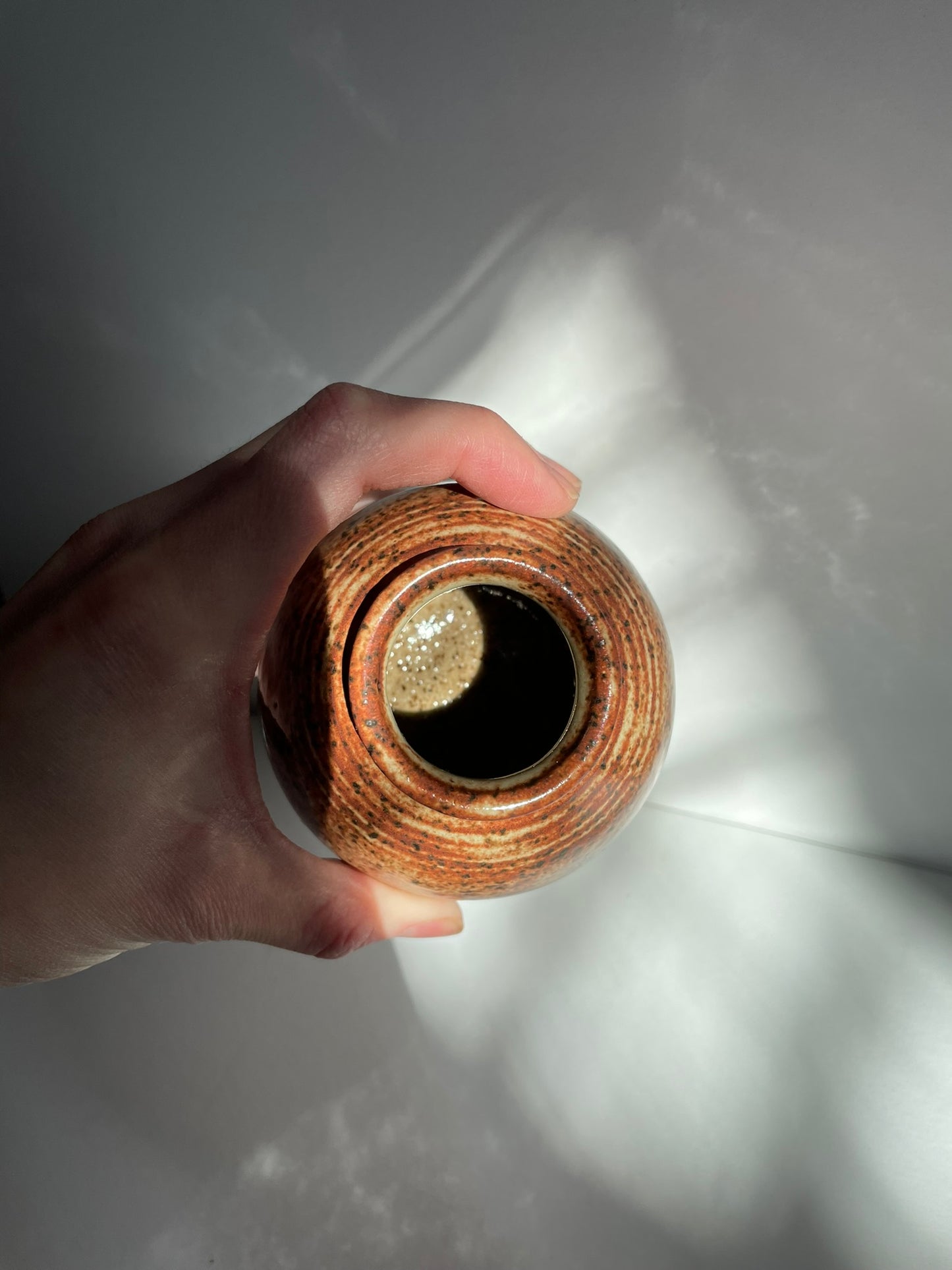 A. Short chai bottle vase with lines