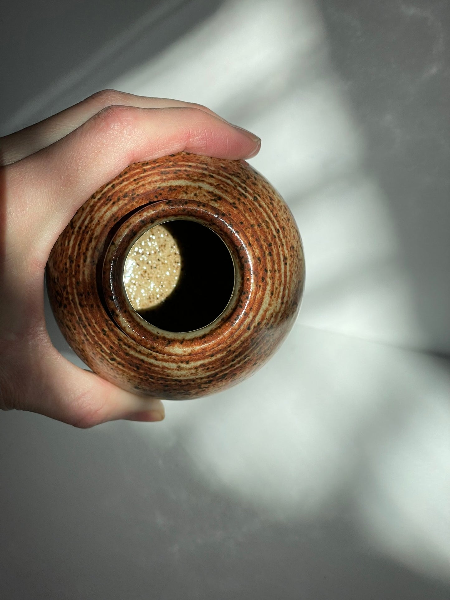 A. Short chai bottle vase with lines