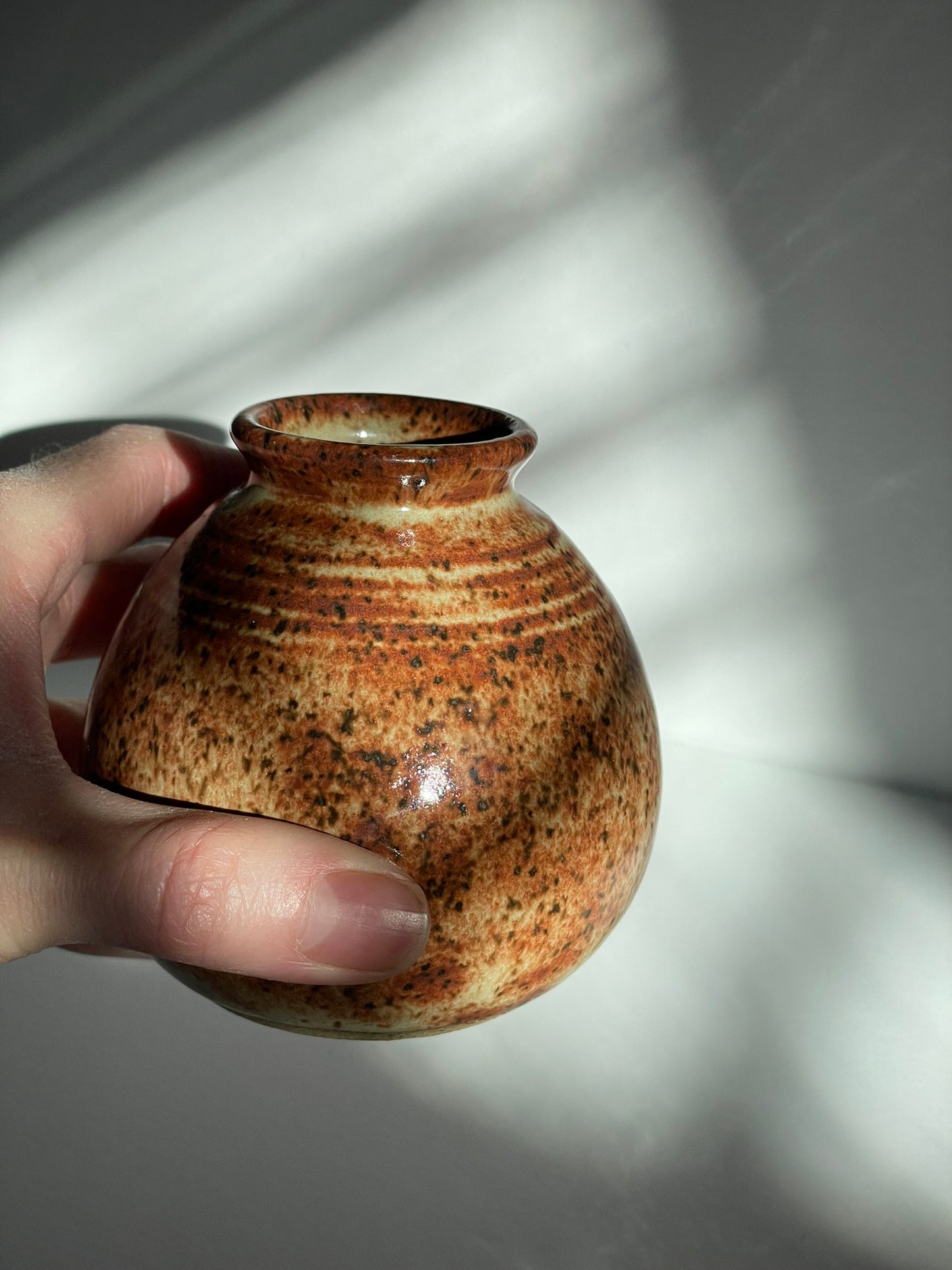 A. Short chai bottle vase with lines