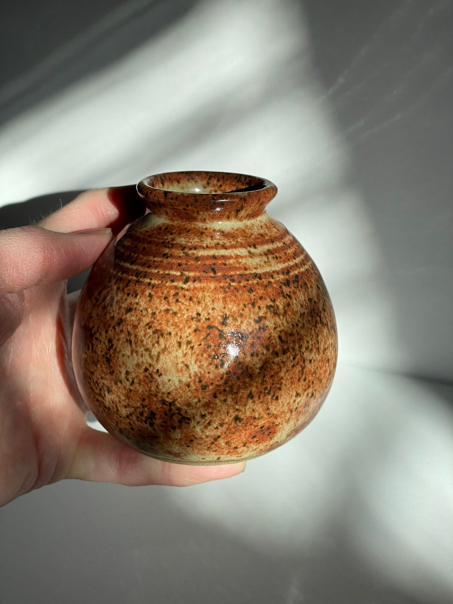 A. Short chai bottle vase with lines